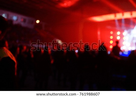texture blur scene multicolored lights and smoke in concert with silhouettes of peopleBackground for design, blur texture, actors on stage