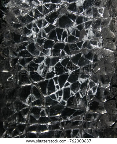 A close-up photograph of shattered glass. This photo was taken in Brisbane, Australia. 