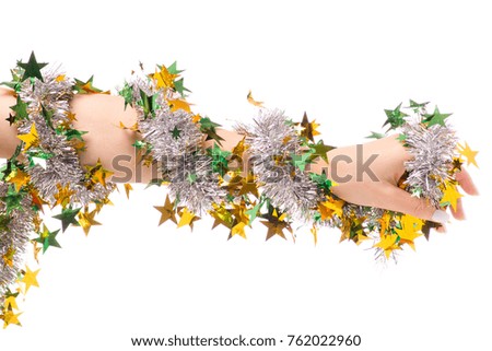 Christmas decoration tinsel gold tree in female hand on white background isolation