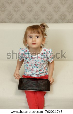 little girl with a tablet