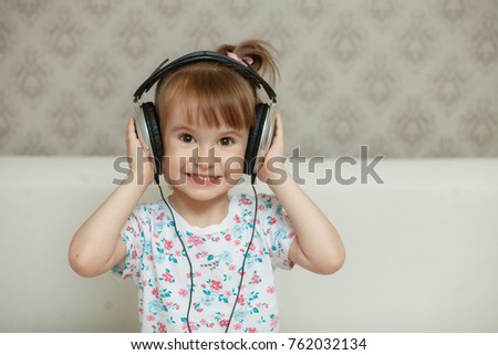 little girl listening to music