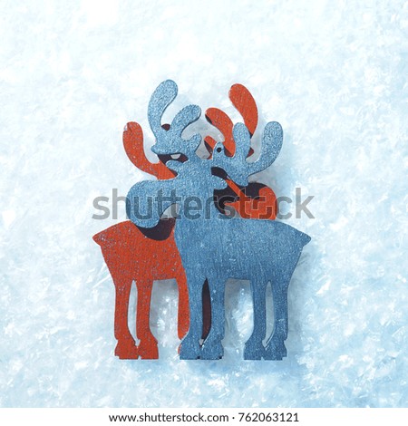 Silhouettes of a pair of Christmas elks on ice transparent background