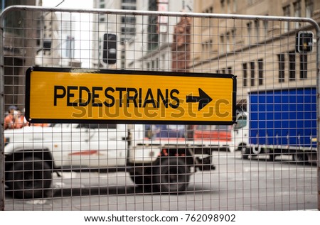 pedestrians sign in city, construction area Sydney