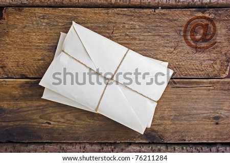 Postage on the background of an old wooden board