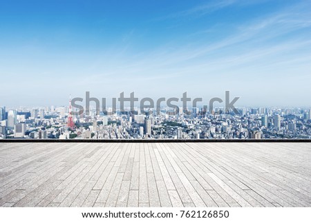 empty marble floor and cityscape of tokyo in blue cloud sky