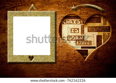 Christmas good wishes greeting and gold empty picture frame hanging old wood wall.