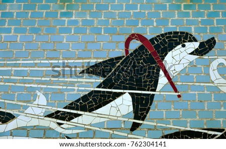 Mosaic decorative background. Mosaic handmade drawing for design. Detail of beautiful old collapsing ceramic mosaic made of multi-colored tiles decorated with buildings. Poseidon with team of dolphins
