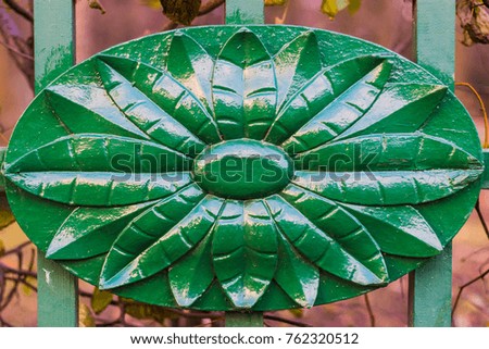 Metal green lattice with emblem