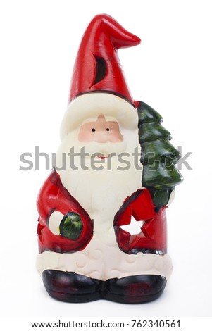 Santa Claus Christmas decoration.. Christmas figurine on isolated white background. Studio photo.
