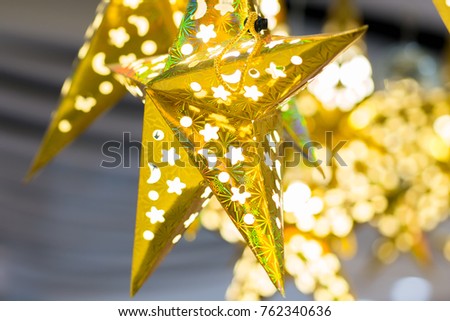 Close up big star with christmas decoration in store, focusing