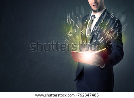 Businessman holding book with letter concept. Royalty-Free Stock Photo #762347485