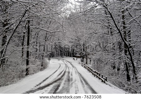  a picture of a snow covered road after a winter storm in indiana