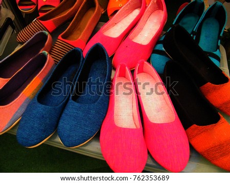 Female shoes at apparel shop.Shopping concept. Colored  shoes.Colorful high heels shoes close up.shoes designs in sri lanka.