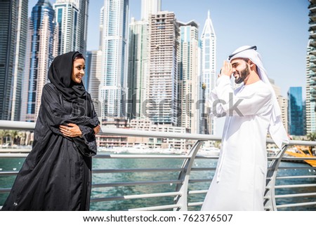 Arabic couple with traditional clothes dating outdoors