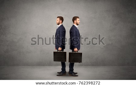 Young conflicted businessman choosing between two directions