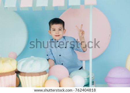 mom and son play and eat a cake