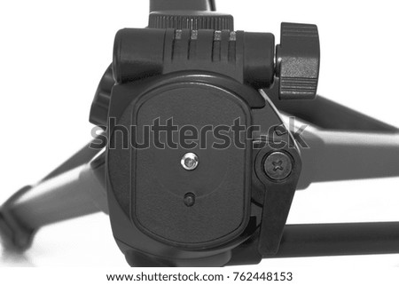 Put together black tripod isolated over white.