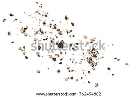 Crushed black peppercorns scattered on white background. Royalty-Free Stock Photo #762454882