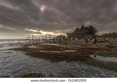 Tanah Lot is a rock formation off the Indonesian island of Bali. It is home to the pilgrimage temple Pura Tanah Lot (literally "Tanah Lot temple"), a popular tourist and cultural icon for photography