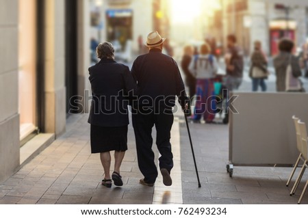 Mature couple of lovers walking hand in hand Royalty-Free Stock Photo #762493234