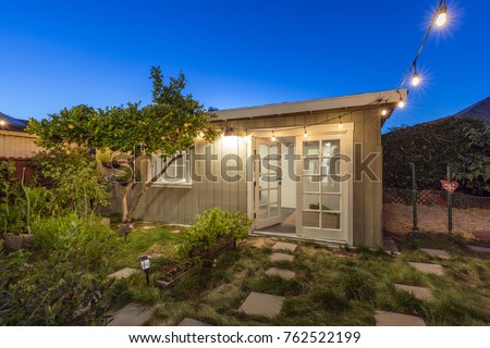 Modern Tiny Home Guest House at twilight.  Royalty-Free Stock Photo #762522199
