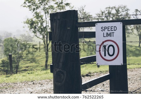 Speed limit 10 sign on rural property