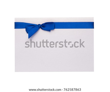 empty sheet of paper and blue ribbon with bow