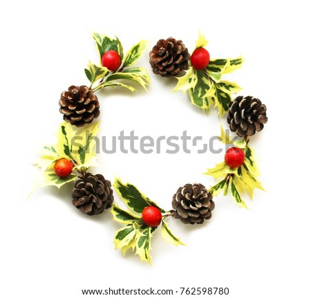 Christmas wreath of holly-olive leaves, pinecones, and Alpinia formosana nuts
