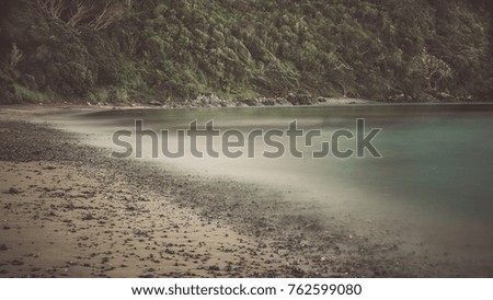 secluded rugged dark beach