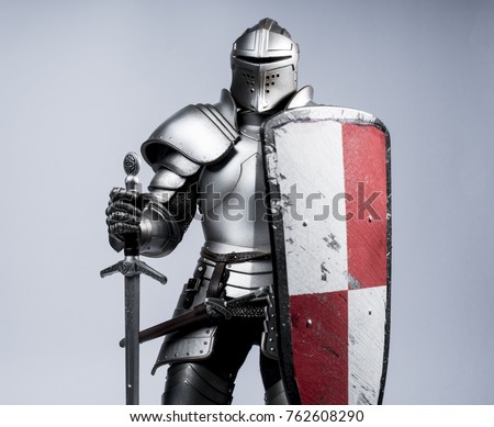 Knight with sword and shield Royalty-Free Stock Photo #762608290