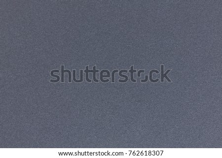 Background of dark grey paper. High resolution photo.