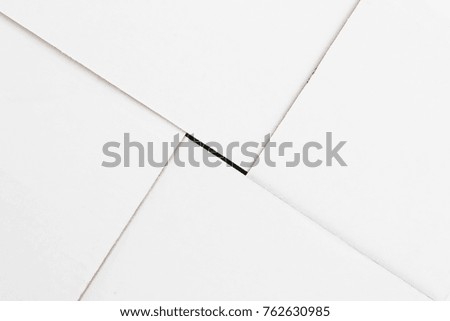 Mailing background. Diagonal edges of cardboard panels of white box.