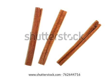 Top view closeup photo image of cinnamon or cannella sticks isolated on white bright background, fold brown wood bark
