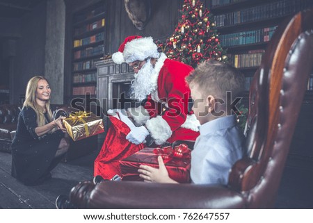 Family home portrait. Parents and son spending time together at christmas time