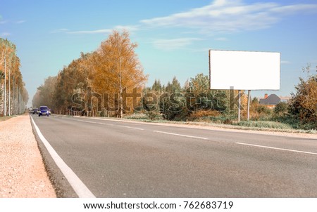 Horizontal shot of billboard on the background of forest and sky, advertising space, space for notes, copy space, background