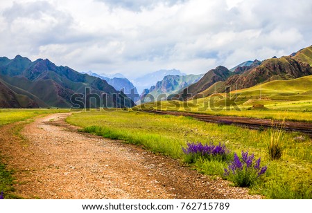 Mountain range road summer landscape Royalty-Free Stock Photo #762715789