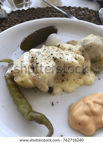 raclette food plate with sauce and vegetables swiss christmas food