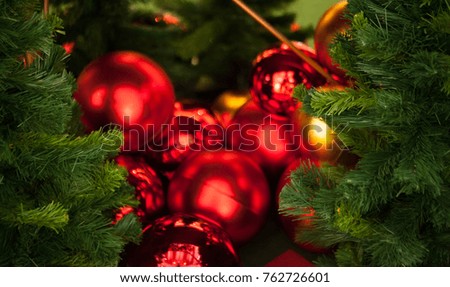 red and golden christmas ball with christmas tree,christmas tree with decorative ball,selective focus