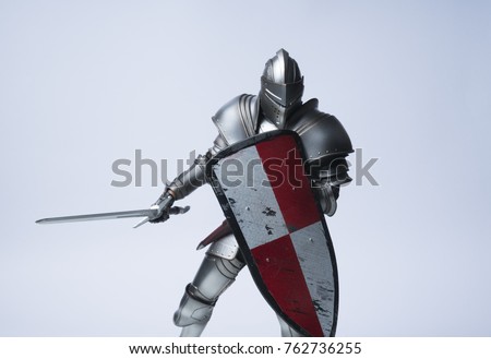 Knight with sword and shield Royalty-Free Stock Photo #762736255