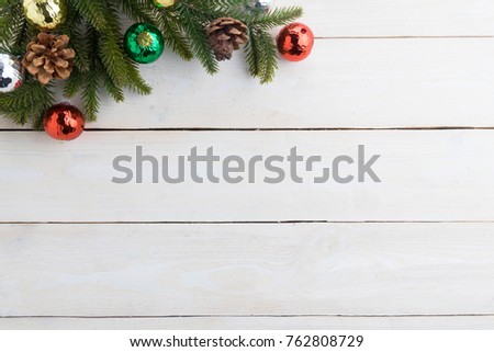 Beautiful red bell with text happy christmas on white wood background
