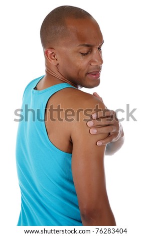 Young attractive African American man athlete suffering from pain in the shoulder. White background. Studio shot.