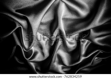 texture, pattern. Fabric made of silk fabric is black, This metallic black abstract jacquard is as magical as a mermaid under the water. The luminous metallic shade is mixed with the spray of color