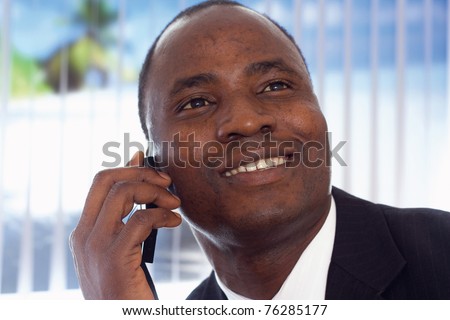 An african-american businessman talking on the phone
