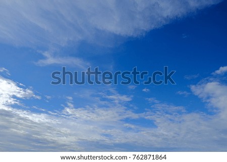 Blue sky and soft cloud with space. The sky is flight path of airplane transportation. Concept can be used for your text design, transportation and used for presentation background. Blur picture.