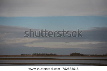 Morning landscape. The shore of the river, sand, tranquility, shallow water. Wallpaper.