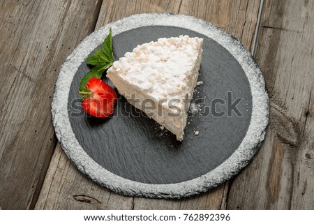 white cake ,vanilla cake ,White chocolate cake. Wooden background