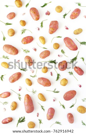 Young potatoes on a white background. Pattern of vegetables. Top view, flat lay. Composition pattern of potatoes.	