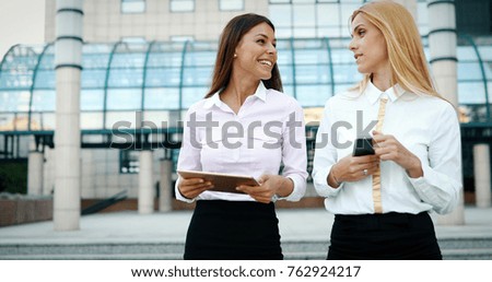 Picture of two young beautiful women as business partners