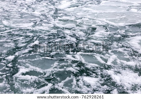 Sea covered with broken ice. Front focus. Black sea in winter