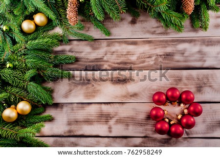 Christmas fir tree on natural rustic wooden background.
